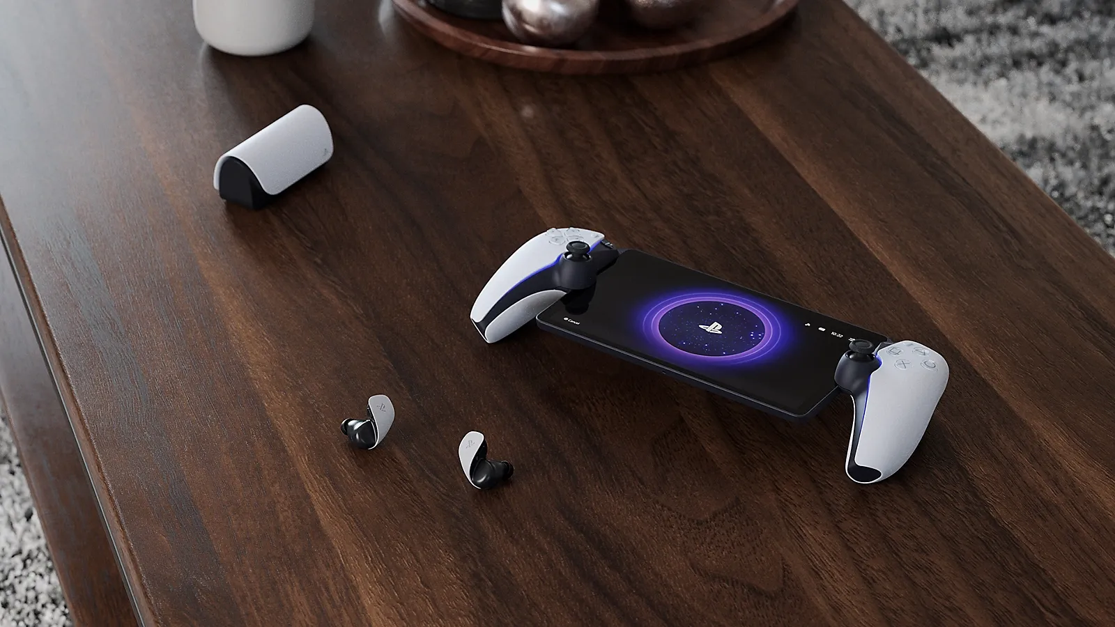 PlayStation Portal a bezdrátová sluchátka PULSE Explore na stole